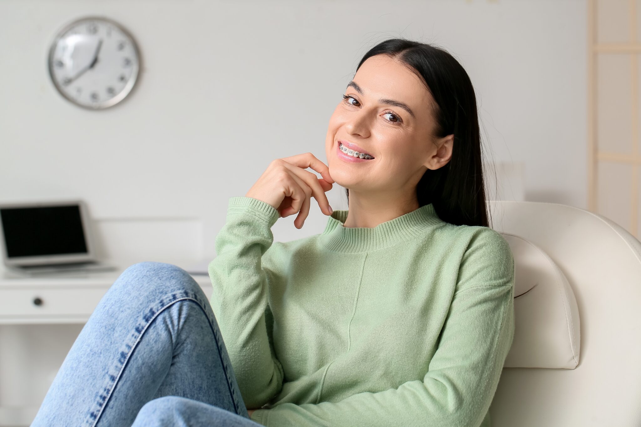 Patient smiling during orthodontic consultation discussing affordable braces and Invisalign financing in Albany NY
