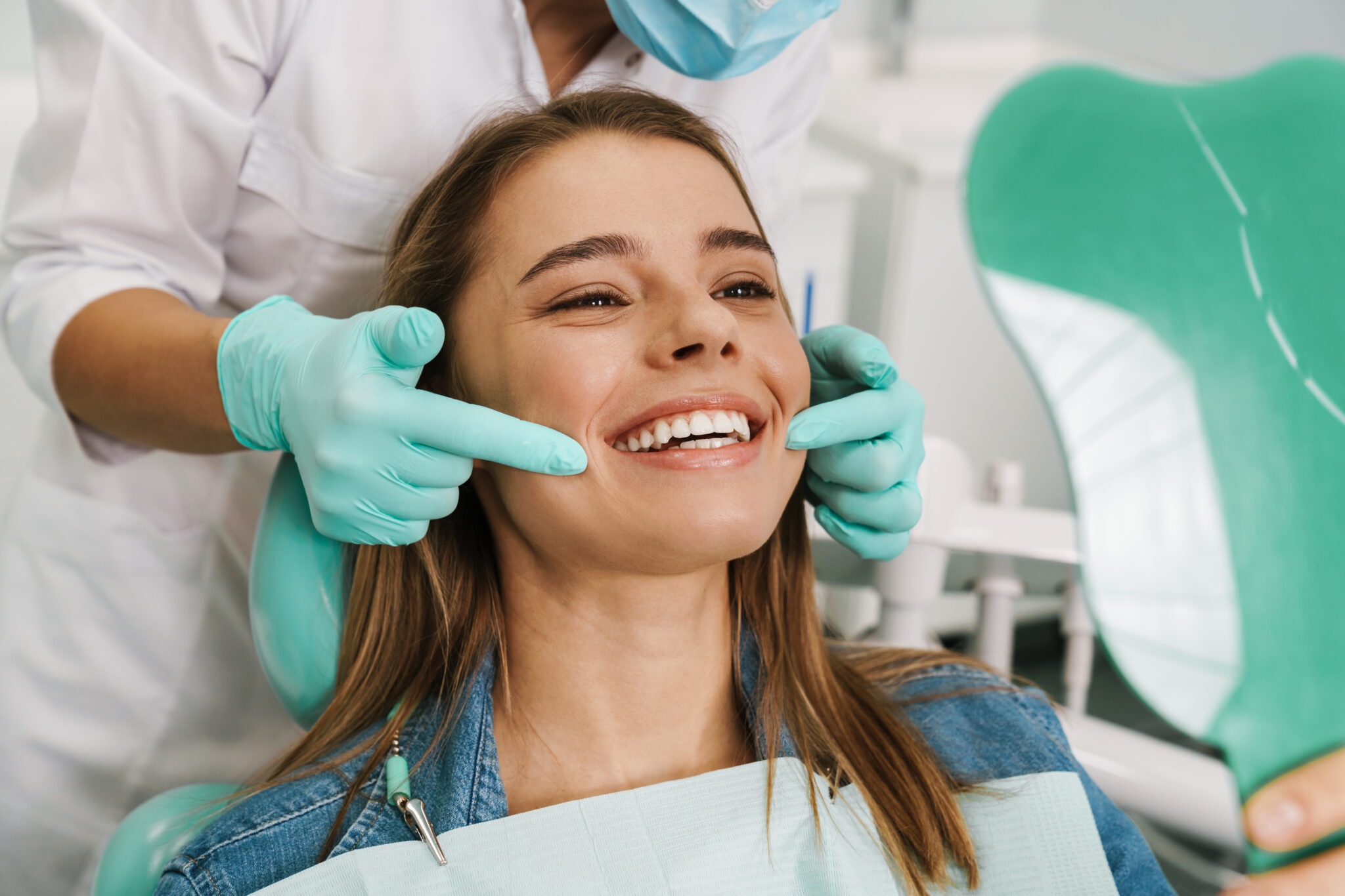 Woman smiling with bright white teeth after professional teeth whitening treatment